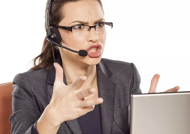 angry-customer-support-call-center-agent-on-a-call-by-laptop
